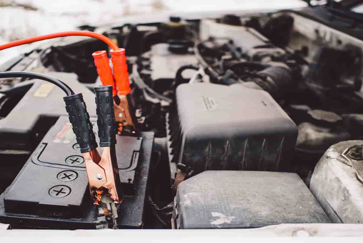 Car battery being tested and replaced in an engine bay — mobile battery service in Hopkinsville, KY