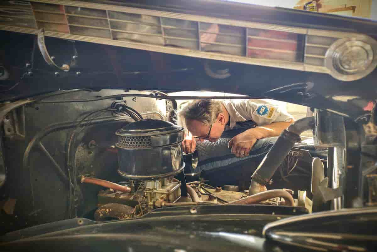 Mechanic inspecting a used car before purchase in the Hopkinsville, KY area