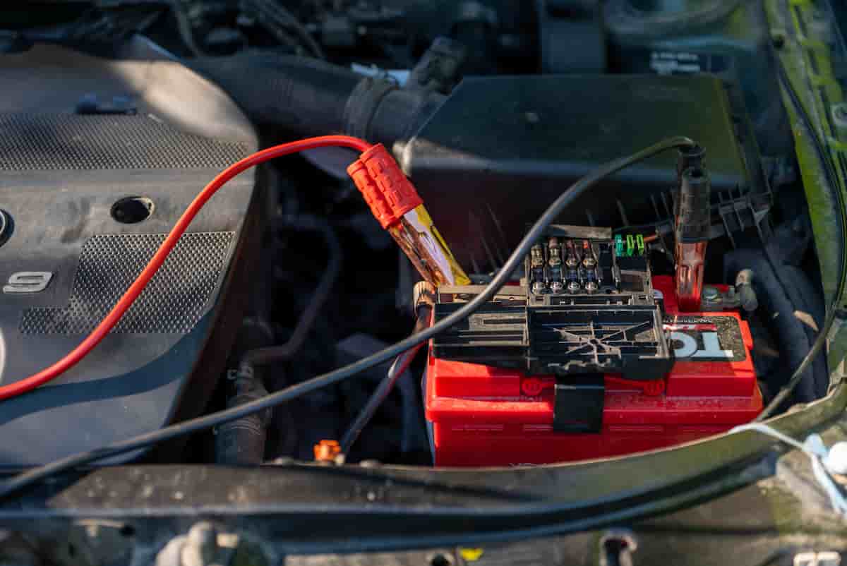 Jump starting a car with cables during a mobile no-start diagnostic visit in Hopkinsville, KY
